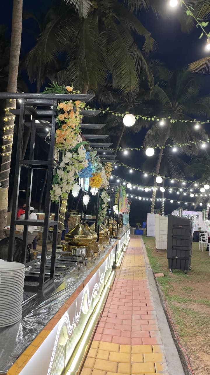 Shanvi Caterers premium outdoor buffet setup with fairy lights for weddings and events in Mangalore